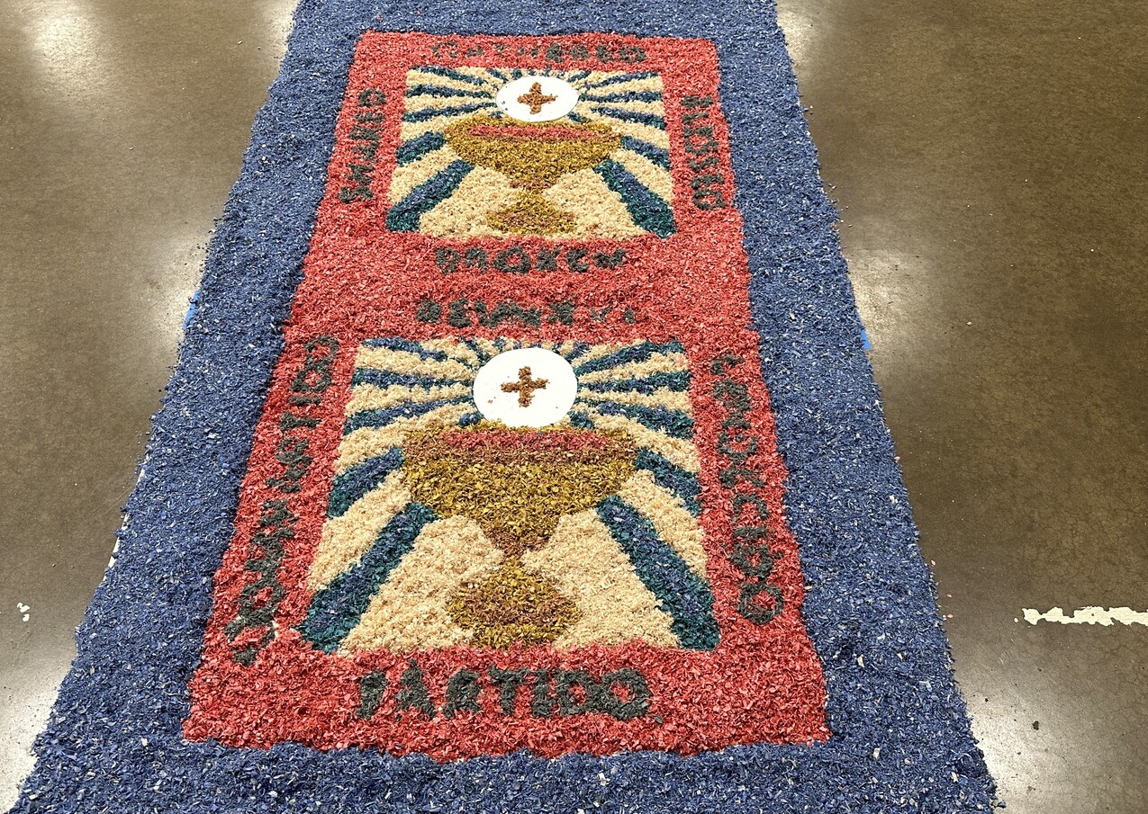 Sacred Heart Chapel parishioners create sawdust carpets for Holy Week