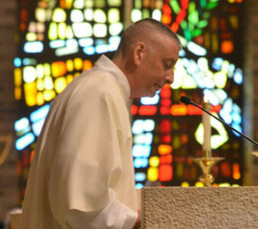 Deacon proclaiming gospel