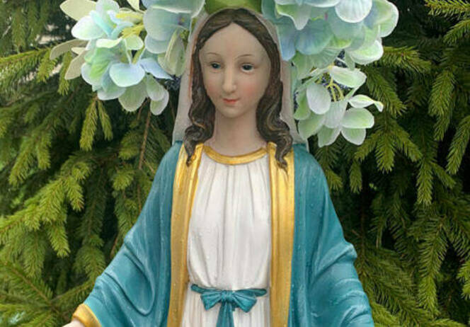 Mary by tree with flowers