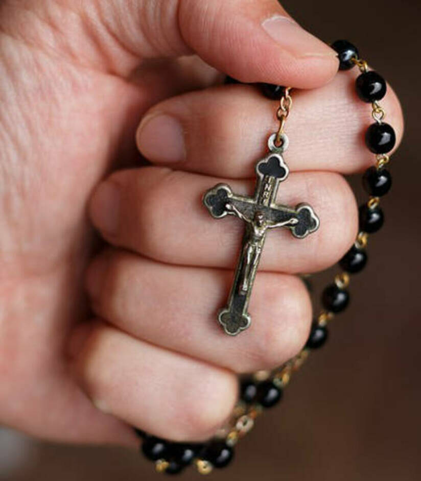 Rosary in hand