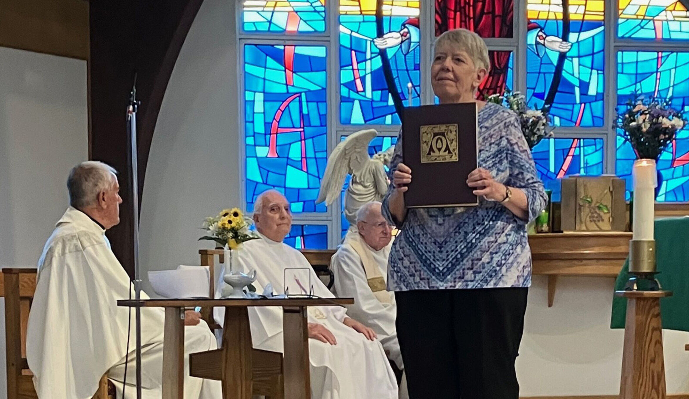Woman holding book nurses mass2